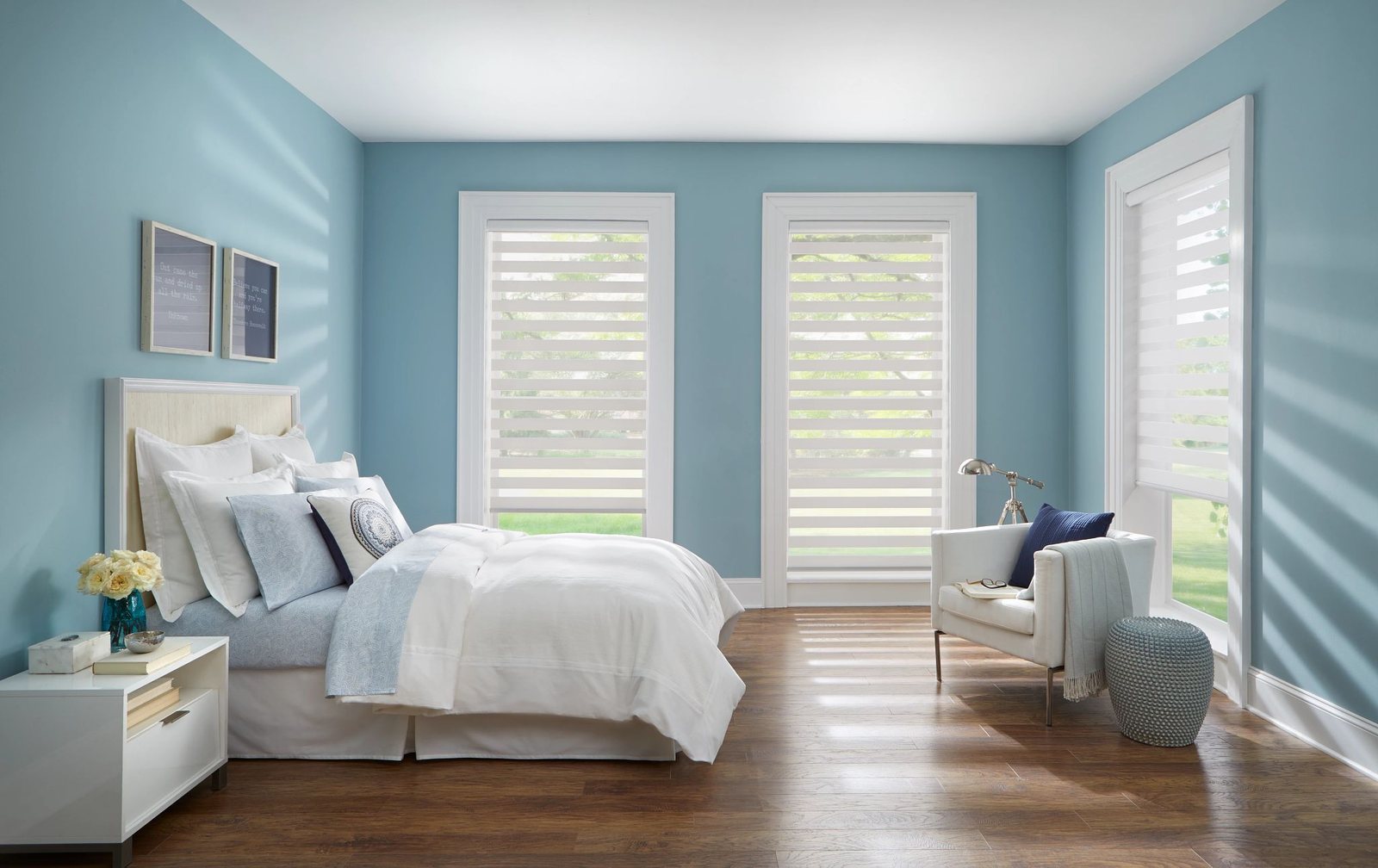 Zebra shades in a blue and white bedroom
