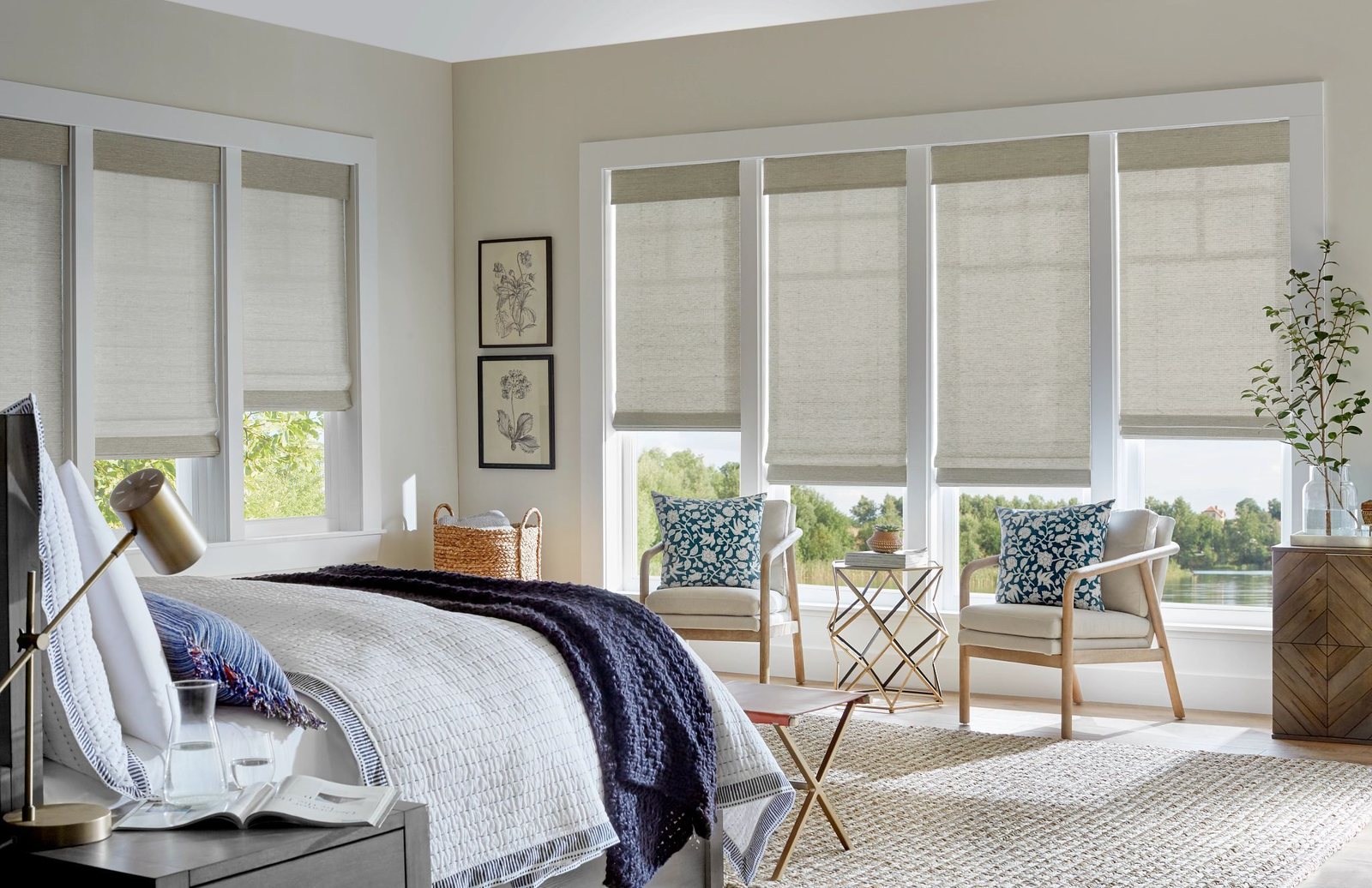 Woven roman shades in a lakeside bedroom