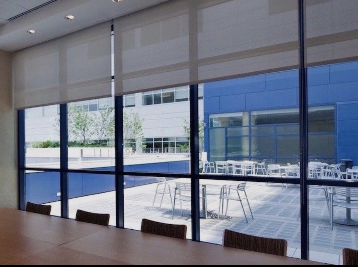 Conference room with patio view and roller shades